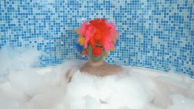 Cute clown man in the bath with copious foam. humorous concept. - Powered by Shutterstock - Get 15% off with code: PIKWIZARD15