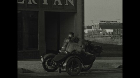 1930s: The motorcycle drives away and leaves the sidecar behind. The monster shakes his hands in frustration. The monster gets out of the motorcycle sidecar.