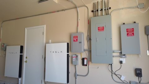 Los Angeles , California / United States - 10 21 2019: Tesla Powerwall Rechargeable Lithium-Ion Battery Energy Storage Unit on House Wall