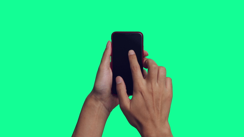 Human hand using a smart phone. Green background for chroma key composition. Royalty-Free Stock Footage #1039885175