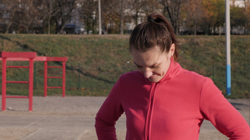
two women  exercising in the morning on the street in the stadium. Running and charging. Sports girls