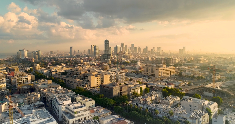 Tel Aviv Skyline from Drone. Aerial shot long super wide horizon view. DayTime Sunset or early morning Color Sky coastline and office building in a modern Tel Aviv