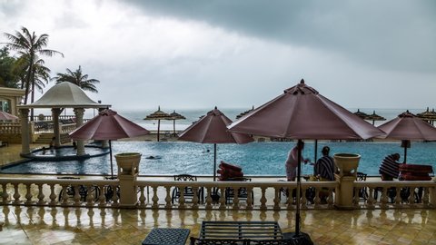 Vung Tau, Vietnam - August 6, 2013 : Rain pouring over a beach resort in Vung tau, Vietnam time lapse