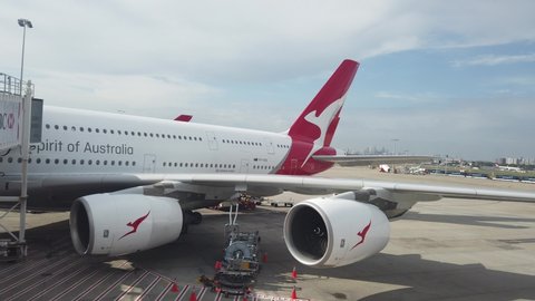 Sydney, NSW / Australia - Oct 17 2019: Kingsford Smith International Airport Large  4 engine Airliner  Parked at Terminal Jetway on a Sunny Day QANTAS AIRBUS A380 - spirit of Australia