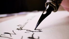 Calligraphy in slow motion. Pan shot of hand written page. Vintage ink pen and quill pen - Powered by Shutterstock - Get 15% off with code: PIKWIZARD15