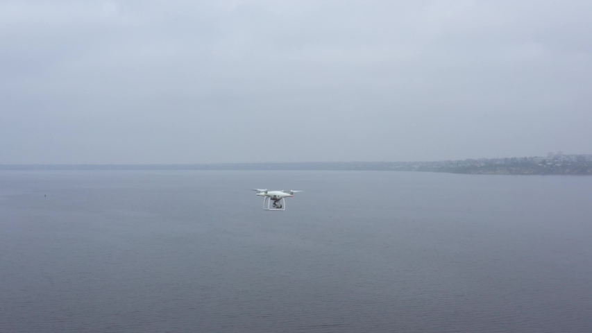 Aerial video drone flying over the river.