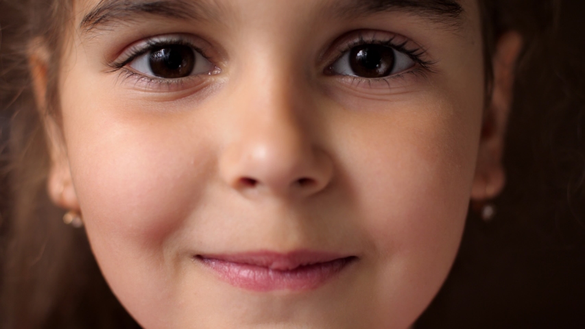 Portrait of a baby girl with a toothless smile. The child laughs hard. Show no teeth. | Shutterstock HD Video #1039915478