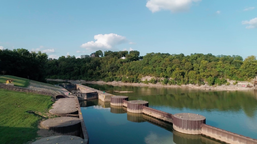 Flying over Kentucky River with dam and lock on sunny day, Frankfort
