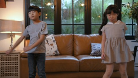 Holiday concept. Children dancing happily in the living room. 4k Resolution.