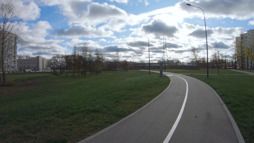 Alley in a city park in the middle of autumn