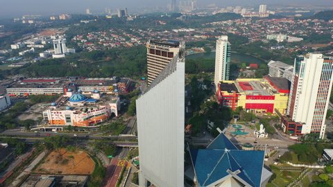 Shah Alam, Malaysia, October 2019: 4K UHD Cinematic Aerial Drone Footage Of Majlis Bandaraya Shah Alam Headquarters Office With Vehicles Moving Around During Sunrise