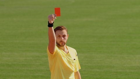 Football Soccer referee shows penalty yellow and red card, 75fps