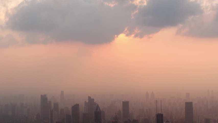 Beautiful sunset with modern city skyline in evening time, 4K Time lapse, beautiful sky with clouds background. Sunset sky clouds and Shanghai skyline, aerial view, b roll shot.