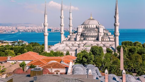 High angle view of The Blue Mosque in front of the sea of Marmara and Bosporus, Istanbul, Turkey time lapse