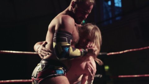Pro wrestlers submission holds, wrestling match footage