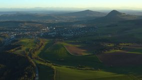 Aerial view around the City Engen and Bargen in Germany. On a sunny afternoon in Autumn, fall. Time lapse panorama view with zoom out from Engen.