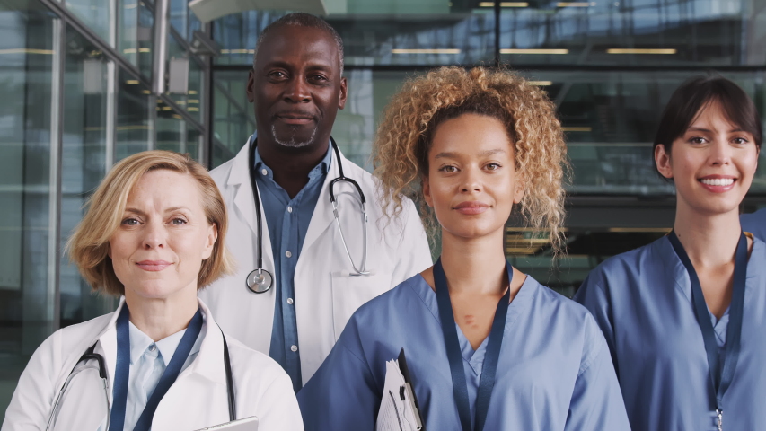 Portrait Of Medical Team Standing In Modern Hospital Building Royalty-Free Stock Footage #1039963271