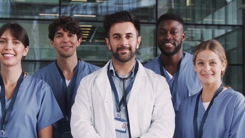 Portrait Of Medical Team Standing In Modern Hospital Building
