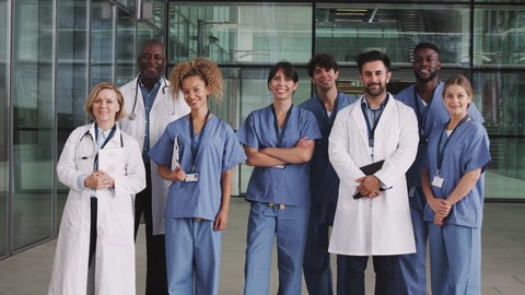 Portrait Of Medical Team Standing In Modern Hospital Building