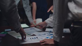 Asia businessmen and businesswomen meeting brainstorm ideas about new paperwork finance project colleague working together plan success strategy teamwork in small modern night office. 4k Slow motion. - Powered by Shutterstock - Get 15% off with code: PIKWIZARD15