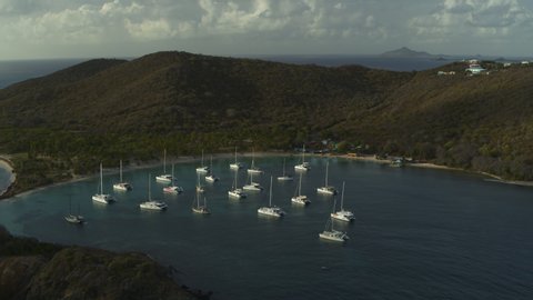 Aerial view of catamaran boats in bay near island / Salt Whistle Bay, Mayreau, St. Vincent and the Grenadines