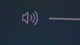 Clicking the volume mute icon in a computer screen monitor, closeup macro showing each individual pixel