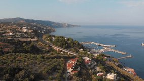 The coast of the Cretan Sea. View of the sea and the road. Aerial video