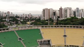An exceptional aerial view of Pacaembu Stadium in Sao Paulo with the Brazilian and Sao Paulo State Flag shot in 4K. Sao Paulo. Brazil.