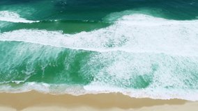 Top View of the Giant Waves, Foaming and Splashing in the Ocean, Sunny Day, Slow Motion Video. Aerial view. Cinematic 4K.