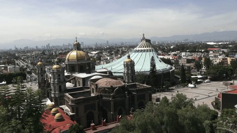 MEXICO, MEXICO CITY-OCTOBER 15, 2019: Mexico City panorama from the hill of Our Lady of Guadalupe, dome in the foreground of the sanctuary, background skyscrapers and city skyline