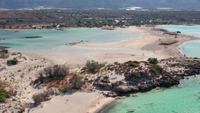 Aerial view video from drone on Elafonisi sandy beach on Crete. Elafonissi is one of the most known world beaches and is famous for pink sand. Kissamos, Chania prefecture, Crete Island, Greece.