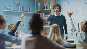 Teacher Explains Lesson to a Diverse Classroom of Bright Children. In Elementary School with Group of Bright Multiethnic Kids Learning Science, Raising Hands with an Answer. Arc Moving Camera - Powered by Shutterstock - Get 15% off with code: PIKWIZARD15
