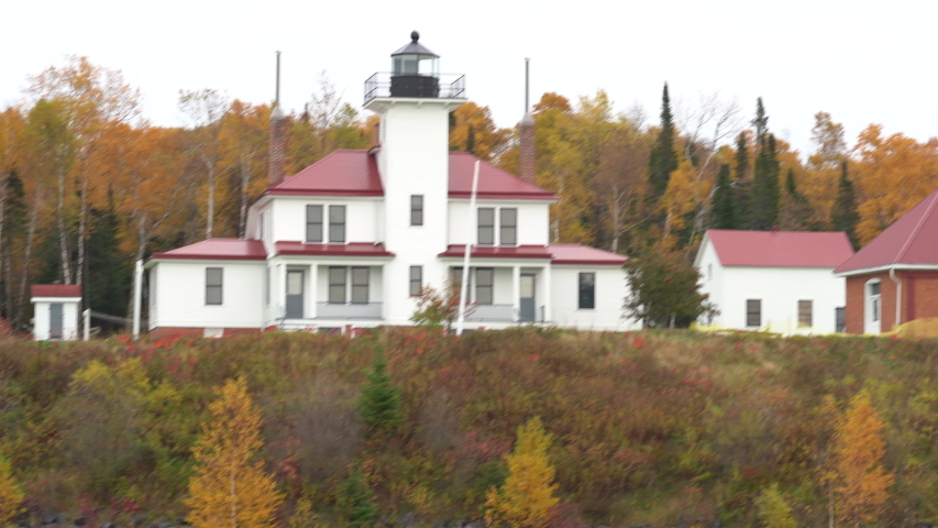 Panning shot of Raspberry Island Lighthouse in Apostle Islands National Lakeshore in Bayfield Wisconsin. Located on Lake Superior.