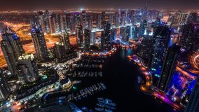 Dubai Marina & Yacht club at Jumeirah Beach in Dubai, United Arab Emirates time lapse at night pan