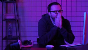 Tired programmer looking at some process on the computer. - Powered by Shutterstock - Get 15% off with code: PIKWIZARD15