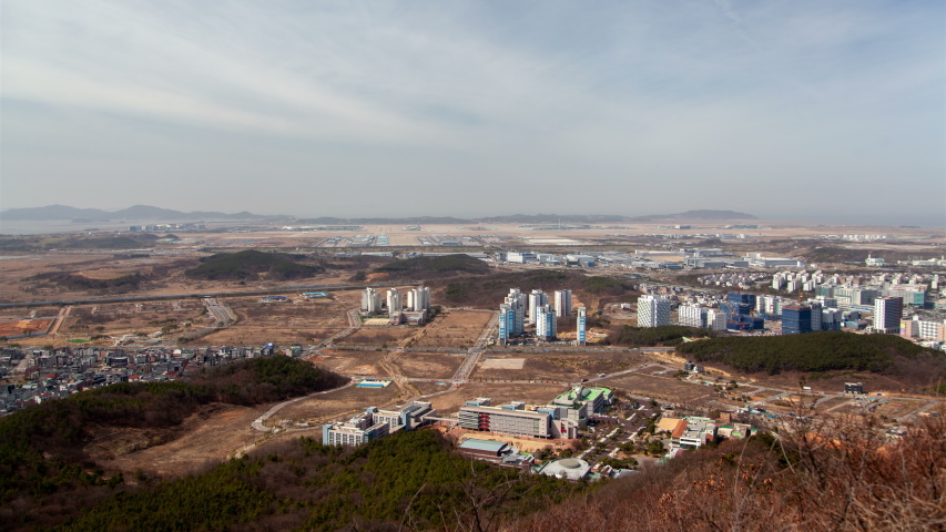 Timelapse Incheon buildings and roads with driving cars, South Korea