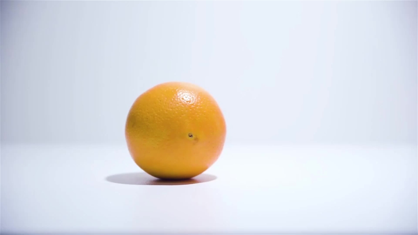 Symbol related people / objects / elements attracted to each other. Orange rolled to an orange. Royalty-Free Stock Footage #1040059634