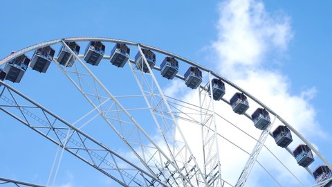ferris wheel against blue sky 4k footage real time