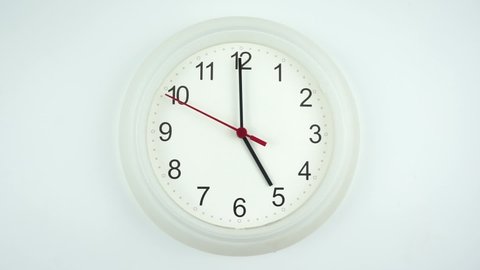 The beginning of time 05.00 am or pm, Closeup White wall clock Red second hand minute Walk slowly, Time concept.