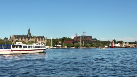 Boat passing in front of Nordiska Museet and Vasa Museum - Stockholm Djurgardsbrunnsviken -