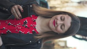 Beautiful portrait vertical video young happy attractive woman using mobile phone on street walk smartphone city girl lifestyle caucasian technology urban beautiful businesswoman outdoors slow motion
