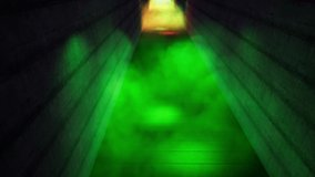 Dark corridor with colorful illumination animation. Moving forward in scary black pathway with smoke on floor footage. Green and red neon light flashlights flickering in hallway realistic video