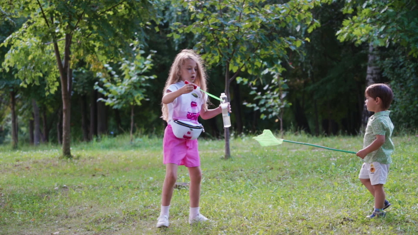 Children playing in park. View of children having fun in park