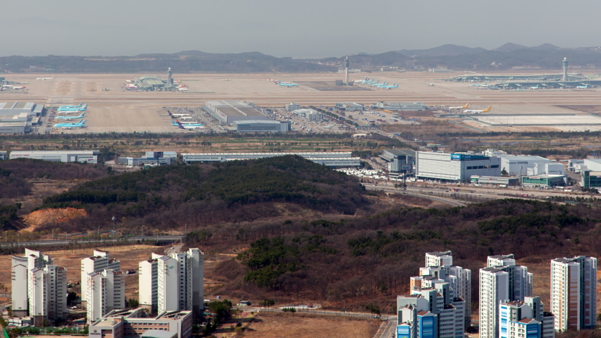 Timelapse planes on modern Incheon airport airfield, South Korea