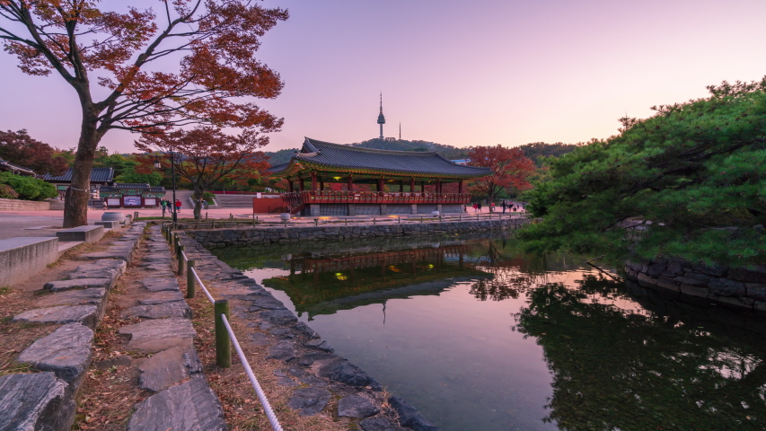 Time lapse Autumn of Namsangol Hannok Village and Seoul Tower at night in Seoul,South Korea.