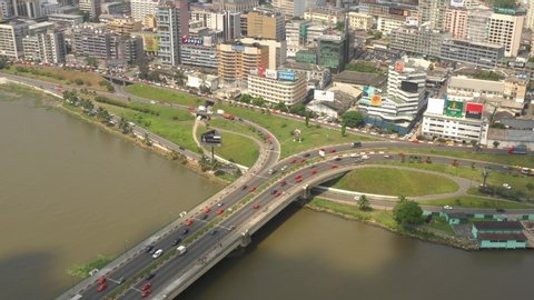 Abidjan, Ivory Coast - 2019: drone aerial view of the city, Général de Gaulle bridge and big road interchange.