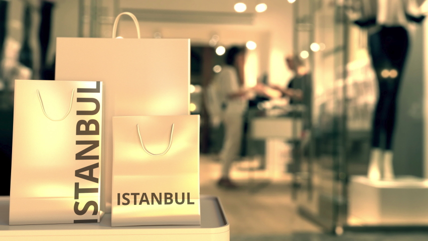 Shopping bags with ISTANBUL text against blurred store. Turkish shopping related clip
