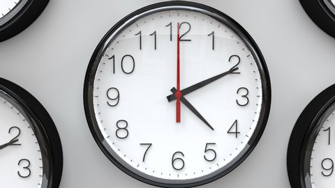 Clocks running fast. Multiple wall clocks in white background spinning fast.