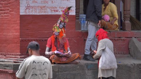 Kathmandu,Pashupatinath temple / Nepal - 20 october 2019 :  Sadhu men, holy person in hinduism with traditional painted face at Pashupatinath Temple of Kathmandu