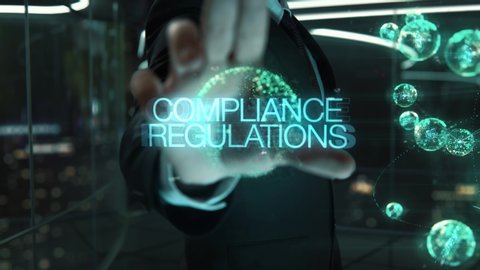Businessman with Compliance Regulations hologram concept